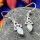 Sterling Silver Opal Trinity Earrings on Grey stone