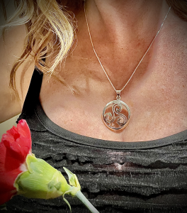 Model wearing sterling silver pendant